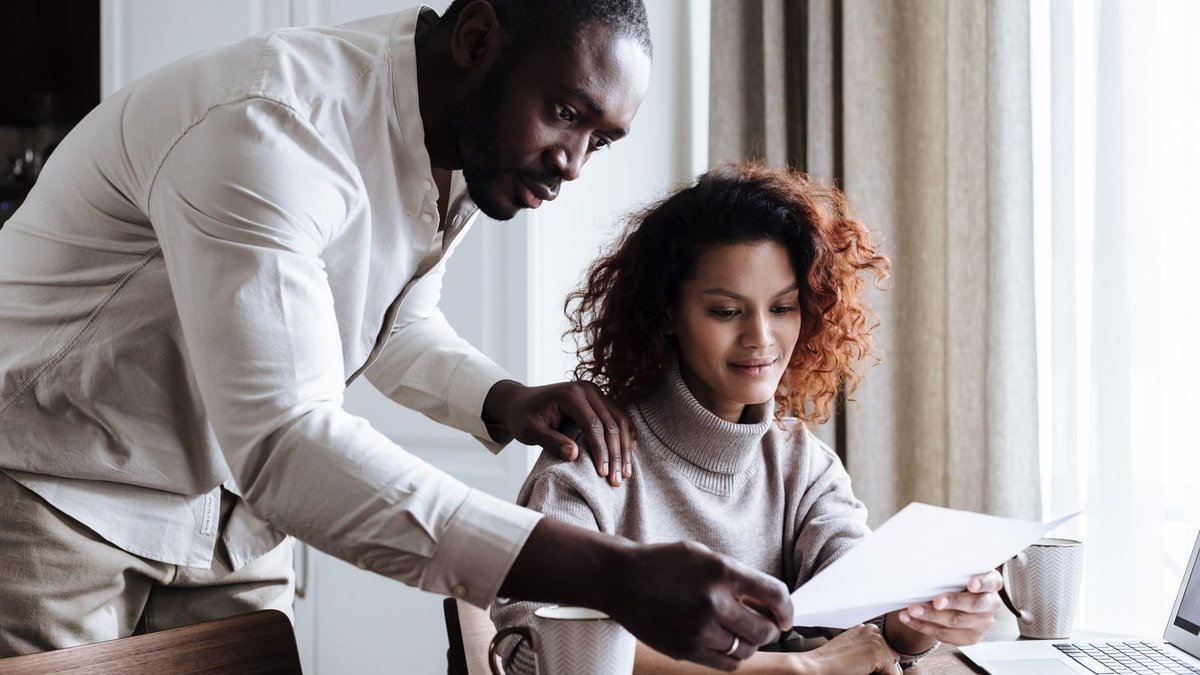 Couple reviewing paperwork together